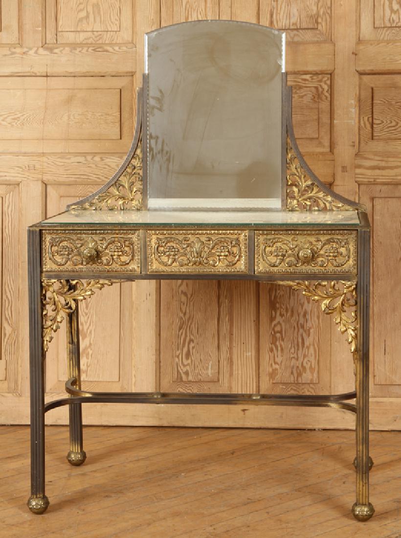 UNUSUAL ITALIAN BRASS GLASS DRESSING TABLE C.1930: An unusual Italian brass and glass dressing table circa 1930. Having a mirrored back, two drawers and cast foliate decoration. Ht: 52" Wd: 35" Dia: 17.5"