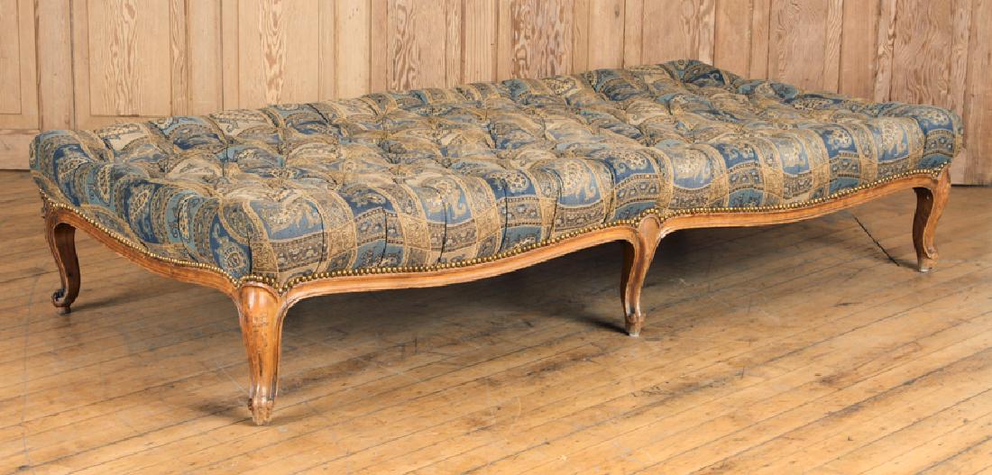 LOUIS XV STYLE PETITE DAY BED SHAPED CARVED C1920: An eight leg Louis XV style petite day bed having a shaped and carved frame circa 1920. Ht: 13.5" Wd: 67" Dpth: 33"