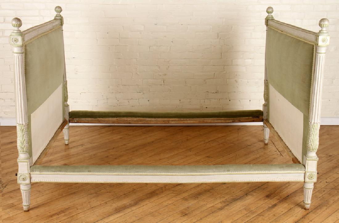 FRENCH CARVED PAINTED LOUIS XVI STYLE DAYBED 1880: A substantial French carved and painted Louis XVI style daybed having foliate and floral carvings circa 1880. Ht: 50" Width: 55" Depth: 76"