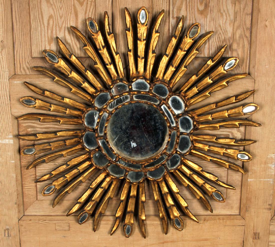 GILT WOOD STARBURST MIRROR MANNER OF LINE VAUTRIN: A gilt wood and resin convex starburst mirror having feather decoration in the manner of Line Vautrin. Dia: 24"