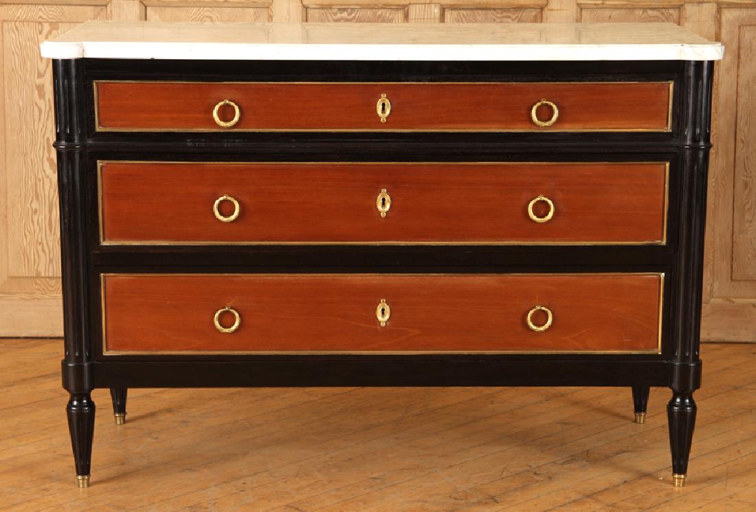MAHOGANY EBONIZED COMMODE LOUIS XVI STYLE C. 1940: A two tone mahogany and ebonized three drawer commode in the Louis XVI style having a marble top and bronze mounts throughout circa 1940. Ht: 32.5" Wd: 47.5" Dpth: 18.5"