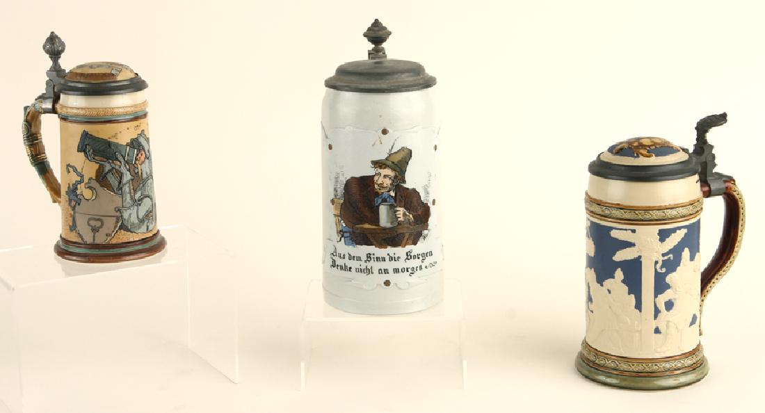 3 GERMAN METTLACH LIDDED BEER STEIN MARKED: A lot of three marked German Mettlach lidded beer steins. To include: #2123, Knight Drinking, 0.3 liter #1533, Mountain Dweller, 1.0 liter #2363, Events in the Black Whale of Ascalon, 0.5 liter All ma