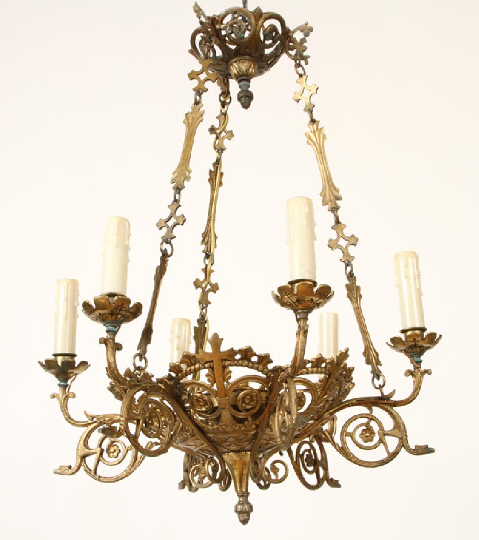SIX ARM GOTHIC STYLE BRASS CHANDELIER C.1920: A six arm Gothic style brass chandelier circa 1920. Ht: 27" Dia: 20"