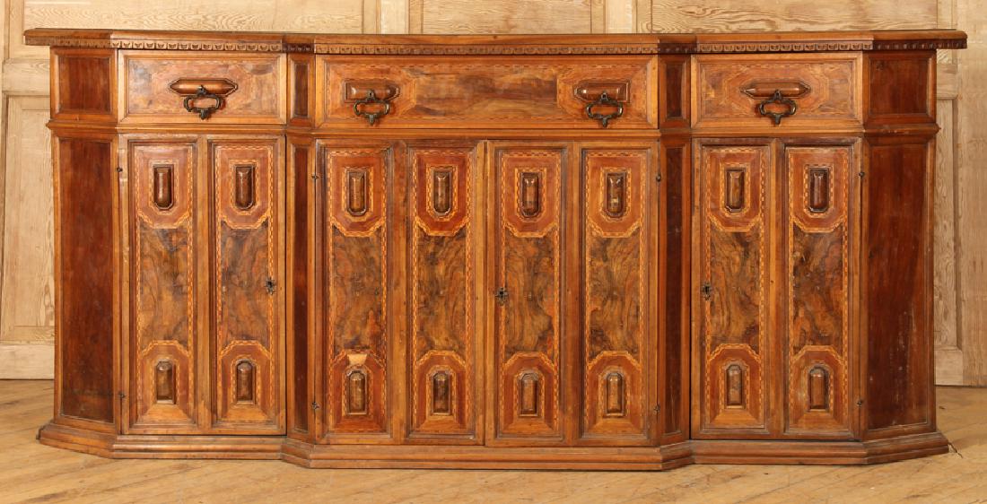 19TH C. ITALIAN WALNUT SIDEBOARD BREAKFRONT FORM: A nineteenth century Italian walnut sideboard of breakfront form. Having five drawers over four doors with mahogany inlay. Ht: 40.25" Wd: 91.5" Dpth: 18.5"