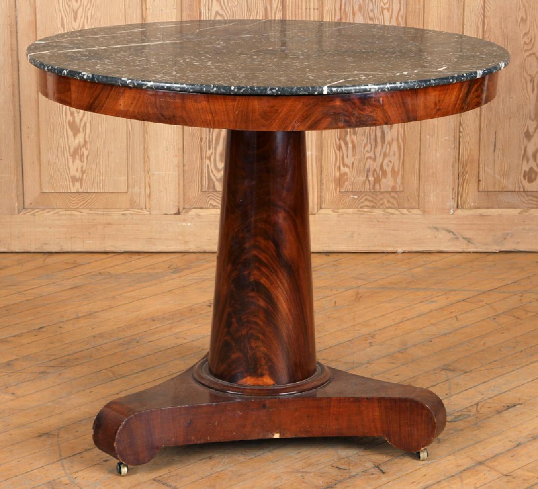 FRENCH EMPIRE MAHOGANY MARBLE TOP GUERIDON C.1880: A French Empire mahogany marble top gueridon circa 1880. Having a black and white marble top. Ht: 27" Dia: 32"
