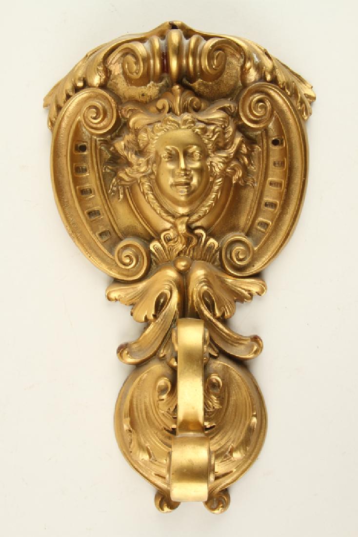BRONZE NEOCLASSICAL DOOR KNOCKER ACANTHUS LEAF: A bronze Neoclassical door knocker having acanthus leaf and scroll design, unmarked. Ht: 13" Wd: 7.5" Dpth: 2.5"