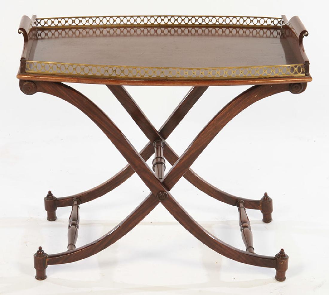 REGENCY STYLE MAHOGANY SIDE TABLE BRASS 1950: A Regency style mahogany side table having brass galleried tray form top supported on x-form legs circa 1950. Ht: 24.5" Wd: 27" Dpth: 19"