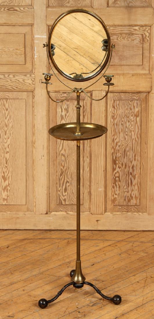 19TH CENTURY BRASS SHAVING STAND ADJUST. MIRROR: A late nineteenth century brass shaving stand having two candle arms and adjustable mirror. Provenance: From the original collection of Richard and Linda Scott from Sidney, OH. Richard and Linda are l