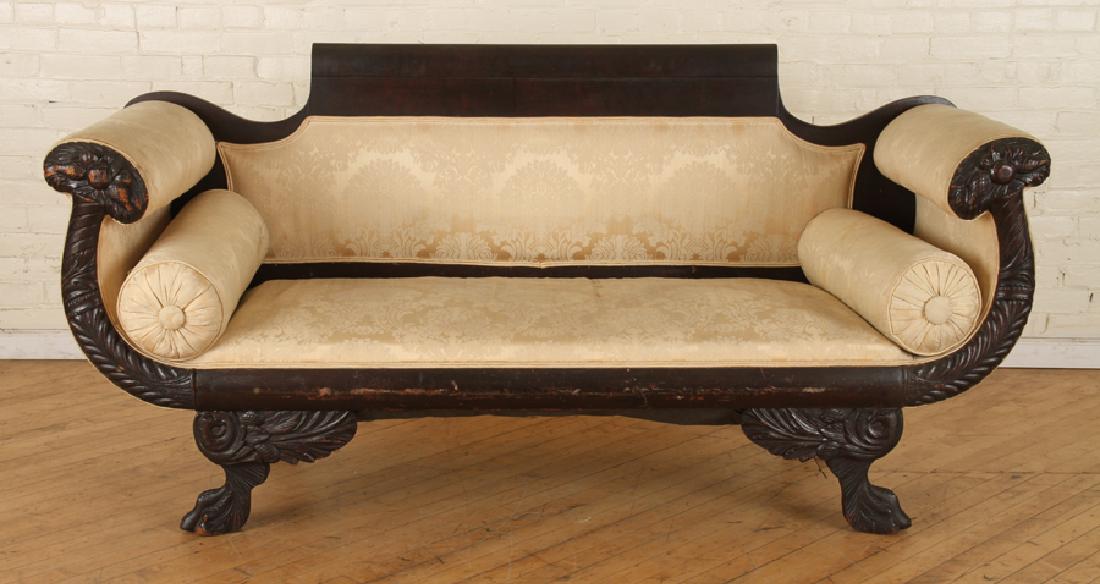 19TH C. AMERICAN CLASSICAL MAHOGANY SOFA CARVED: A nineteenth century American Classical mahogany sofa having upholstered back, carved frame and raised on paw feet. Ht: 36.5" Wd: 73" Dpth: 27"