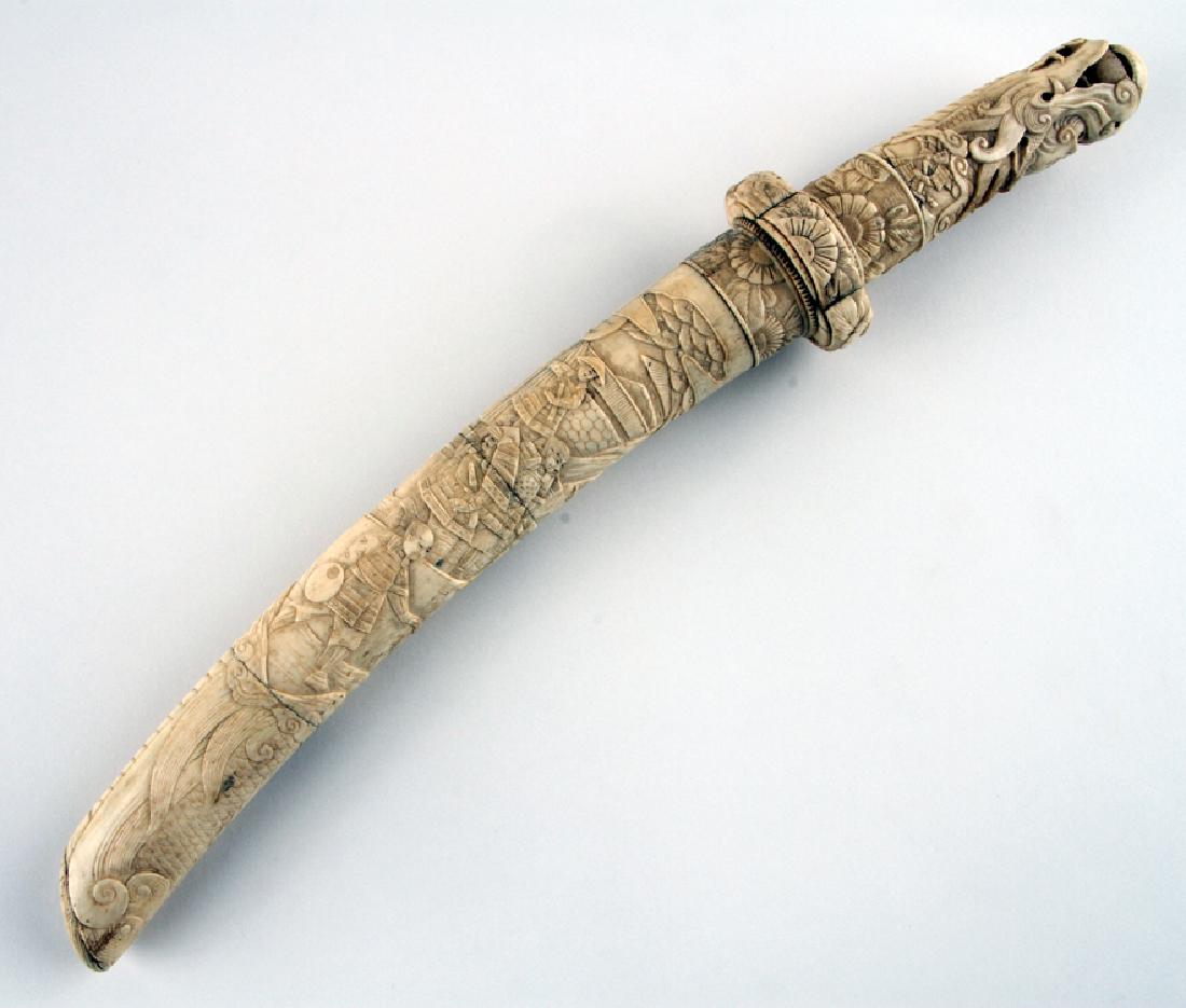 LATE 19TH C CHINESE BONE HANDLED SWORD & SCABBARD: A late nineteenth century Chinese bone handled sword and scabbard. Blade only is 11.25" in length 19.25" overall length