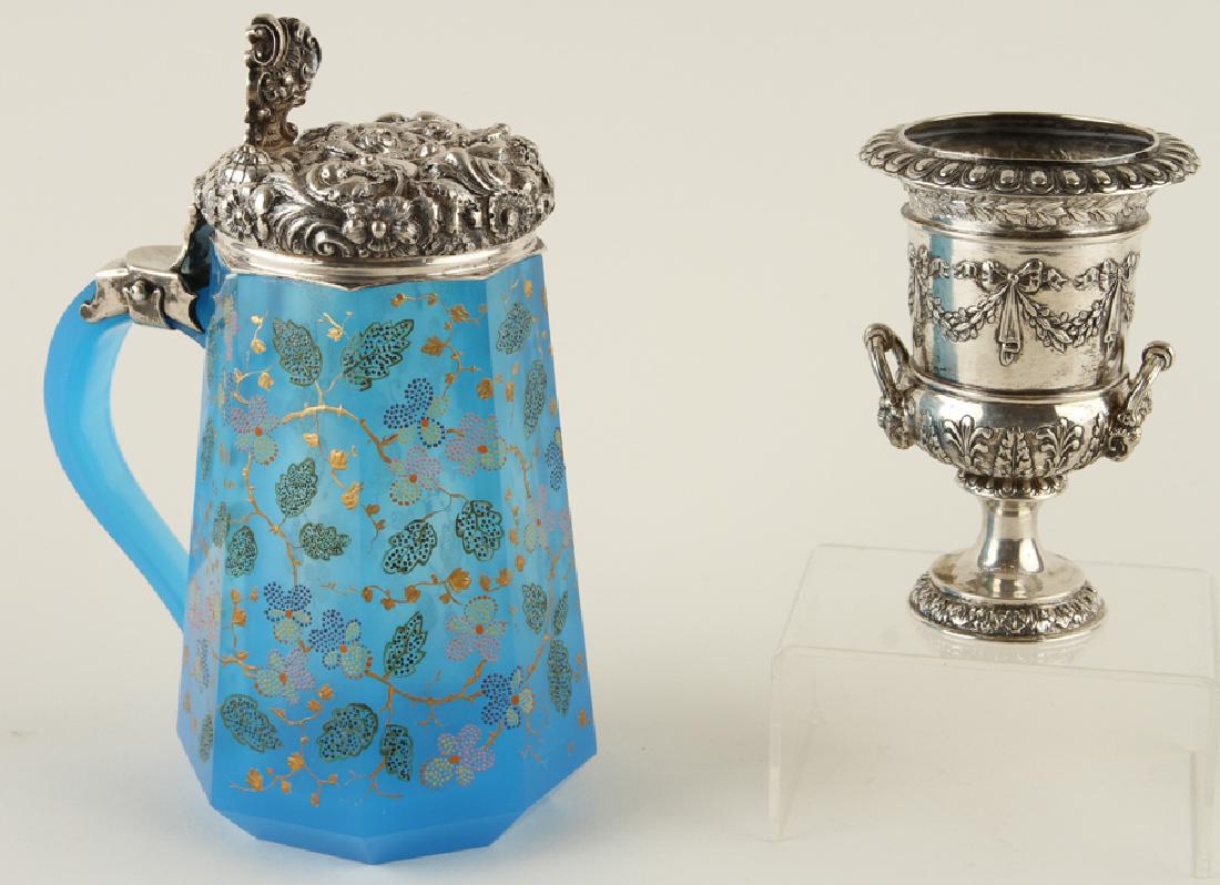 ENAMELED OPALINE GLASS TANKARD & SILVERPLATED URN: An enameled opaline glass tankard with silver cover along with a small silverplated urn. Repousse cover to the tankard: 7.75" The unmarked urn: 4.75"