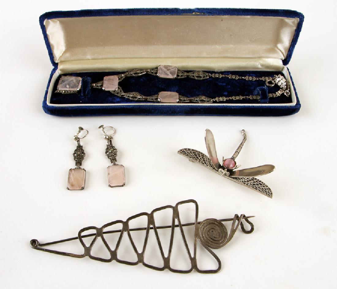5 PC. COLLECTION OF SILVER JEWELRY ART DECO: A five piece collection of silver jewelry. To include: An Art Deco style sterling, marcasite and pink quartz necklace with matching earrings. A contemporary silver dragonfly brooch An Anthony Dirienzi