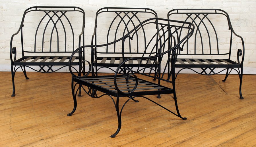 A LOT OF TWENTY-SIX PIECES IRON PATIO FURNITURE: Consisting of four oversized arm chairs, a pair of large spring chairs, eight chairs and one table, a bench, a pair of chairs, a table, a porter's chair, a two-part sofa and pair of benches, a Salteri