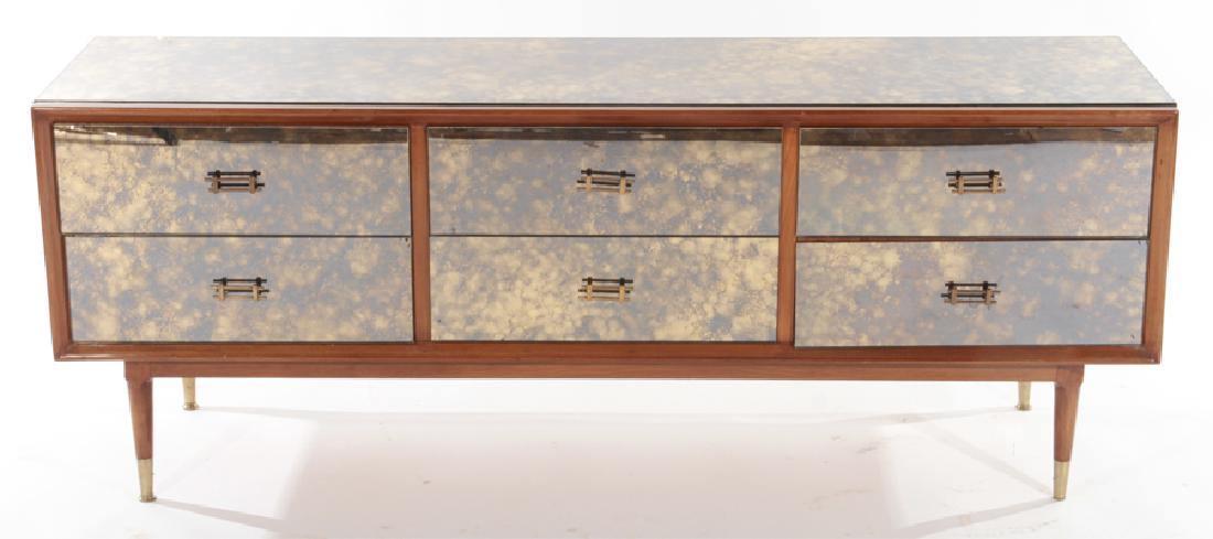 MID CENTURY MODERN MAHOGANY DRESSER C.1960: A mid century modern six drawer mahogany dresser having mottled glass top and drawer fronts circa 1960. Raised on brass trimmed tapered legs. Ht: 24" Wd: 62.5" Dpth: 17"