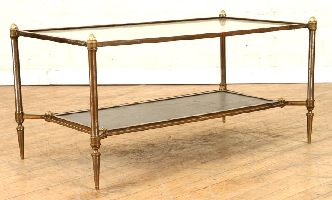 BRASS LEATHER TWO TIER JANSEN COFFEE TABLE C.1950: A brass and leather two tier Jansen coffee table circa 1950. Ht: 17.5" Wd: 36" Dpth: 19"