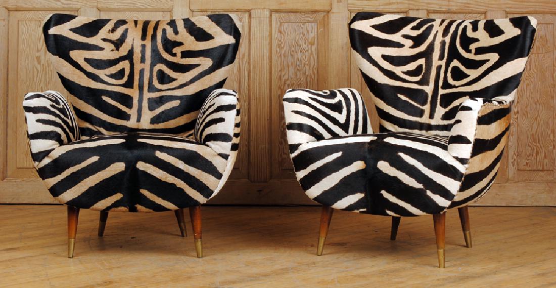 PAIR OF PAOLO BUFFA CLUB CHAIRS CIRCA 1950: A pair of Paolo Buffa club chairs circa 1950. Having been recently reupholstered in leather with a zebra print. Ht: 32" Wd: 28" Dpth: 25" Seat: 16"