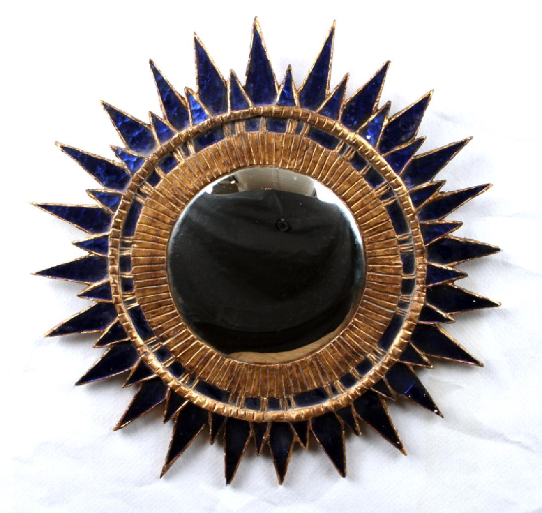 BLUE GLASS STARBURST MIRROR MANNER LINE VAUTRIN: A blue glass starburst mirror in the manner of Line Vautrin. Dia: 28"
