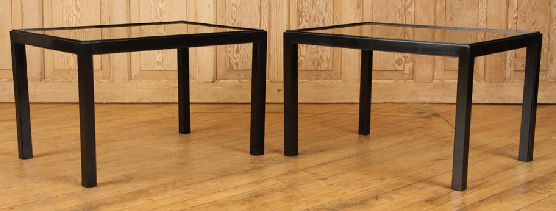 PAIR FRENCH SIDE TABLES MANNER JEAN-MICHEL FRANK: A pair of French ebonized wood small side tables having gold glass tops in the manner of Jean-Michel Frank circa 1950. Ht: 17" Wd: 26.5" Dpth: 19.5"