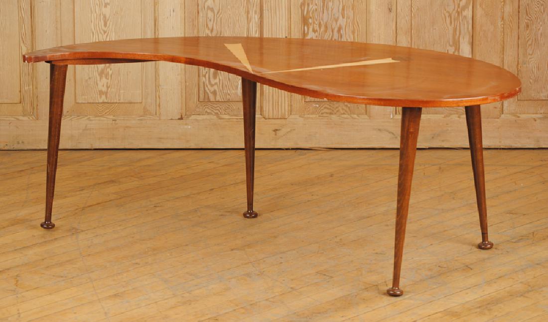 KIDNEY SHAPED MID CENTURY MODERN COFFEE TABLE: A kidney shaped mid century modern inlaid coffee table resting on tapered legs. Ht: 19.5" Wd: 51" Dpth: 23"