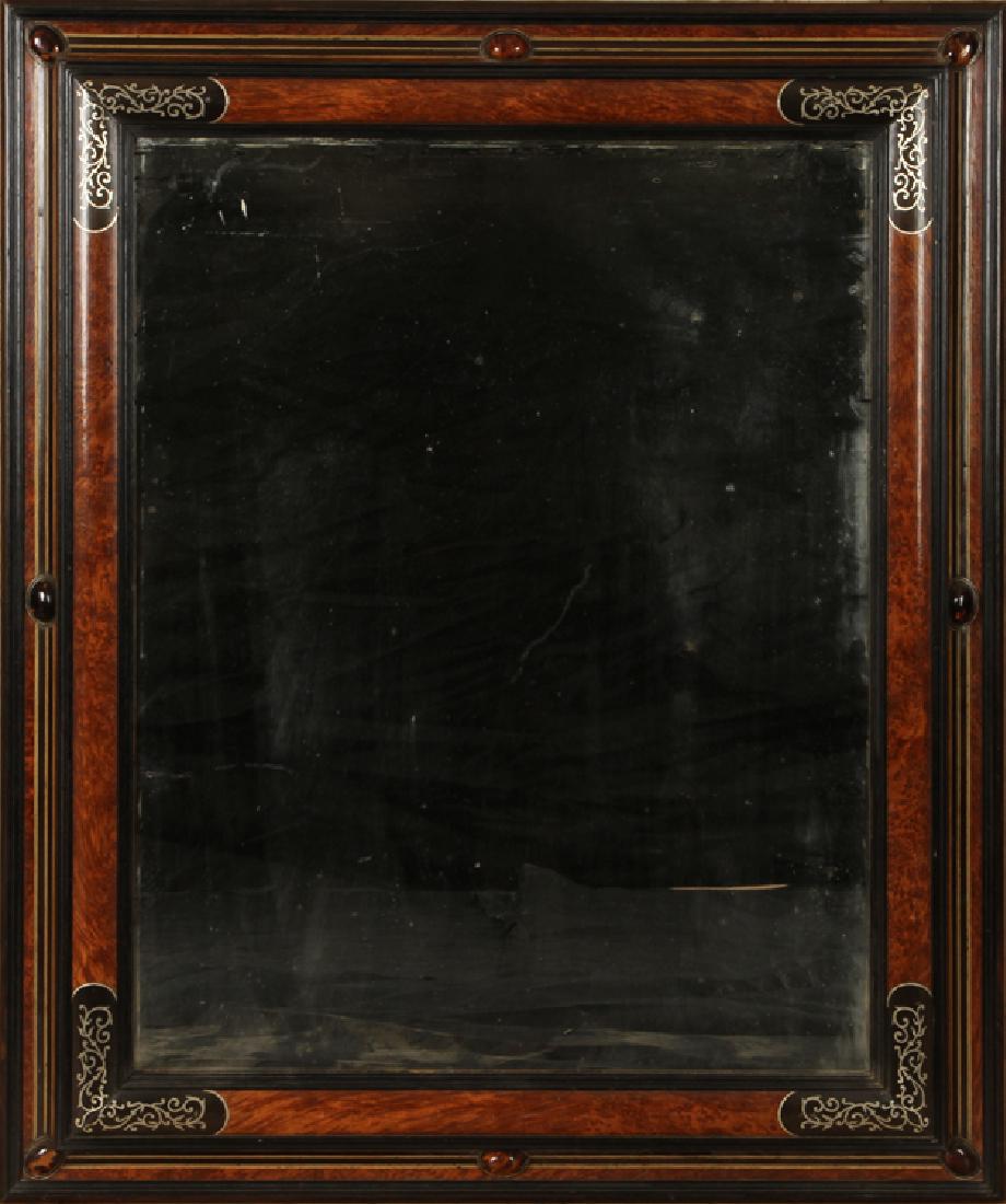 CONTINENTAL MIXED WOOD MIRROR TORTOISE SHELL: A Continental mixed wood mirror having tortoise shell and metal inlay. Ht: 46.5" Wd: 38.5" Dpth: 2"
