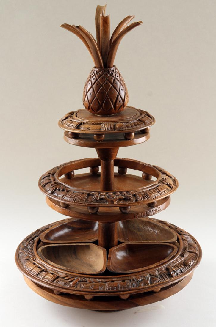 VINTAGE CARVED WOOD LAZY SUSAN FROM PHILIPPINES: A vintage carved wood lazy susan from the Philippines. Ht: 20" Dia: 15.75"