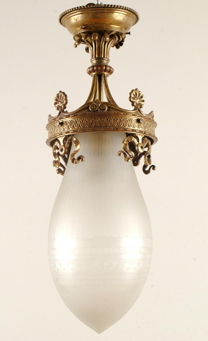 TURN OF THE CENTURY BRASS GLASS PENDANT LIGHT: A turn of the century brass pendant light with glass shades circa 1900. Ht: 19" Width: 7" Depth: 7"