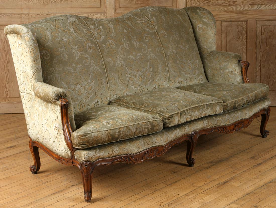 LOUIS XV STYLE CARVED SOFA DOWN CUSHIONS 1920: A Louis XV style carved sofa having down cushions circa 1920. Ht: 40" Wd: 72" Dpth: 30" Seat: 18"