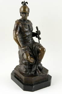 AFTER PIERRE JULIEN BRONZE SCULPTURE ROMAN: After Pierre Julien (French, 1731-1805) A late nineteenth century bronze sculpture of a seated Roman soldier. Ht: 15" Wd: 6.25" Dpth: 7.5"