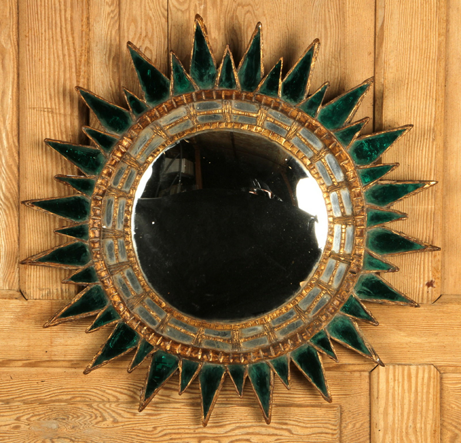 GILT WOOD SUNBURST MIRROR MANNER LINE VAUTRIN: A gilt wood, resin and emerald colored glass sunburst mirror in the manner of Line Vautrin. Dia: 22.5"