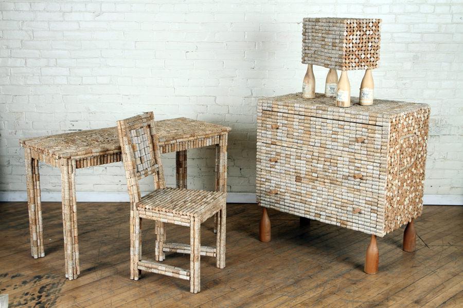 SET 4 TRAMP ART FURNITURE ITEMS WINE CORK DETAILS: A set of four Tramp art furniture items decorated with wine corks by Stephan Palais. Consisting of: A three drawer commode: 37" x 36" x 21" One table: 29" x 48" x 20.5" One chair: 36" x 17" x 19" One 