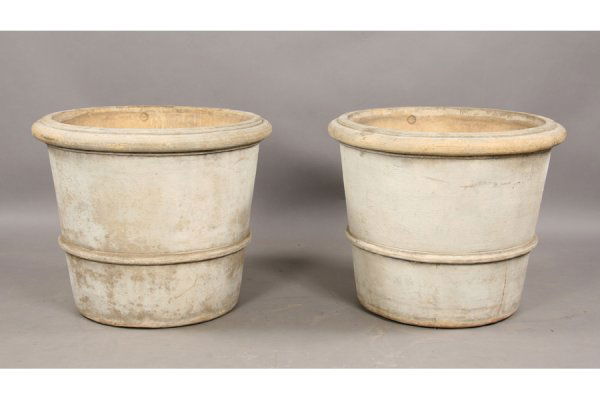 Monumental pair of stamped Galloway pots: A very large pair of stamped Galloway pots in buff colored terra cotta circa 1920. Simple tapered form with heavily rolled rim and lower trim. Ensuite with the previous lot. Ht: 26 Diameter: 31" ***PL