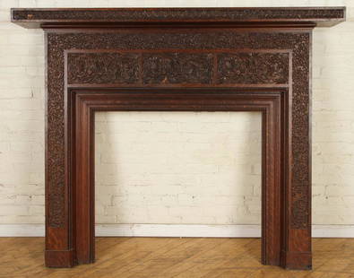 OAK FIREPLACE MANTLE MANNER OF LOCKWOOD DE FOREST: A turn of the century carved oak fire place mantle in the manner of Lockwood de Forest. Interior opening: Ht- 35" Width- 38" Ht: 58.25" Wd: 71" Dpth: 10"