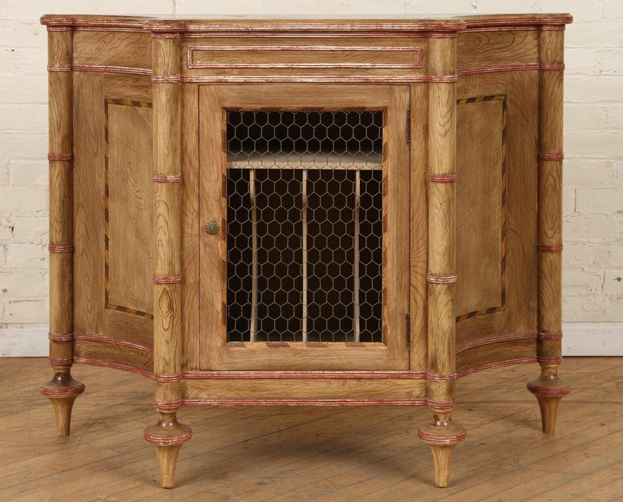 FAUX BOIS PAINTED CABINET WITH FITTED INTERIOR: A faux-bois painted cabinet having fitted interior. Door panel with wire insert opens to one shelf over vertical compartments. Ht: 35.5" Wd: 44.25" Dpth: 16"