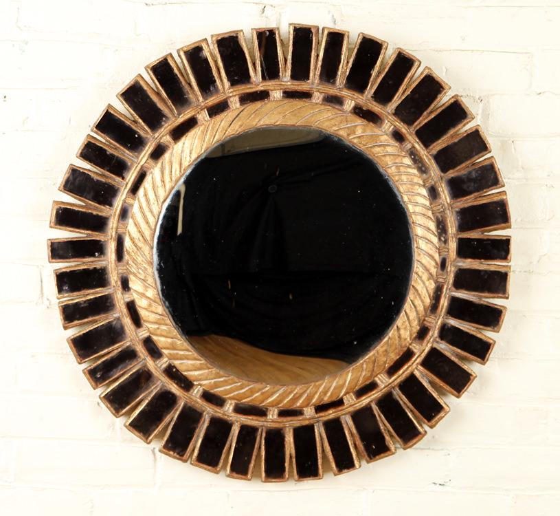 SEGMENTED MIRROR IN MANNER OF LINE VAUTRIN: A round segmented mirror in the manner of Line Vautrin. Having a peach colored glass border housed in a gold gilt frame. Dia: 27.75"
