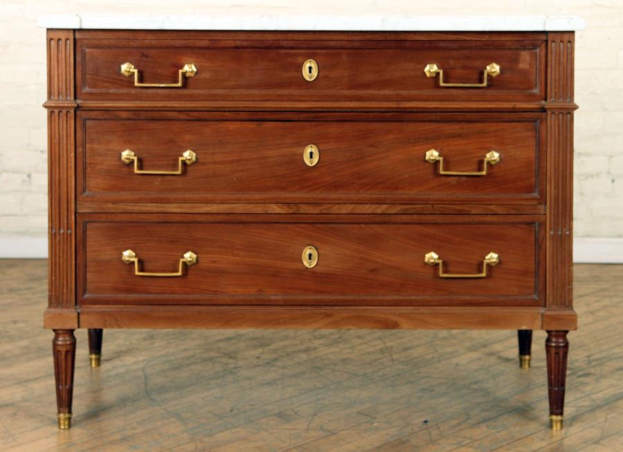 FRENCH MAHOGANY LOUIS XVI STYLE COMMODE C.1920: A French mahogany Louis XVI style marble top commode circa 1920. Ht: 35" Wd: 44" Dpth: 20"