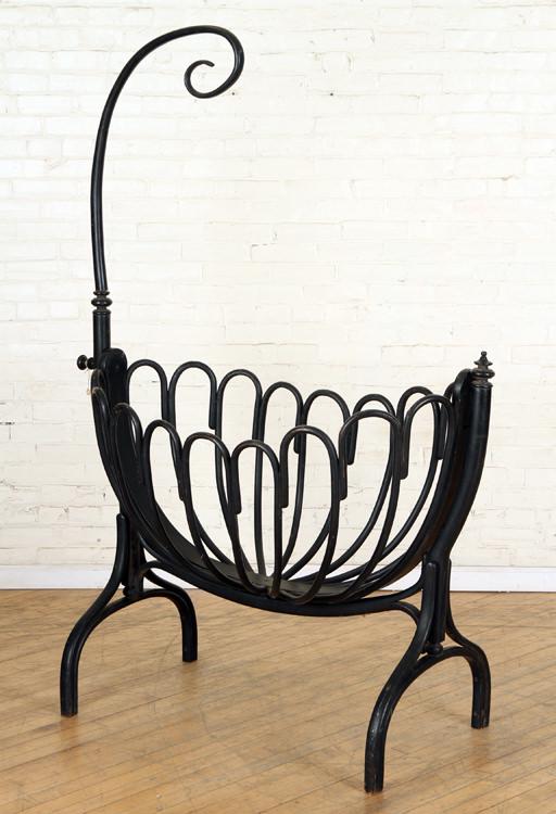 PAINTED BENTWOOD CRIB WITH NET HOLDER C. 1900: A painted bentwood crib having shaped net holder attributed to Thonet circa 1900. Ht: 71" Wd: 49.5" Dpth: 23"