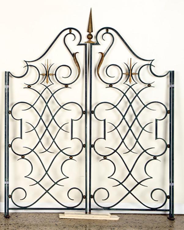 FRENCH IRON GATES MANNER GILBERT POILLERAT C.1945: A great pair of French Art Deco iron gates having geometric design with gilt accents in the manner of Gilbert Poillerat circa 1945. Each panel: 66" x 25.5" Ht: 66" Width: 51.5" (overall)