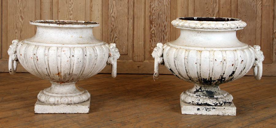 PAIR JJ DUCEL FRENCH 19TH C CAST IRON GARDEN URNS: A good pair of French nineteenth century cast iron garden urns by JJ Ducel. Having lion head with rings. Ht: 21" Dia: 23"