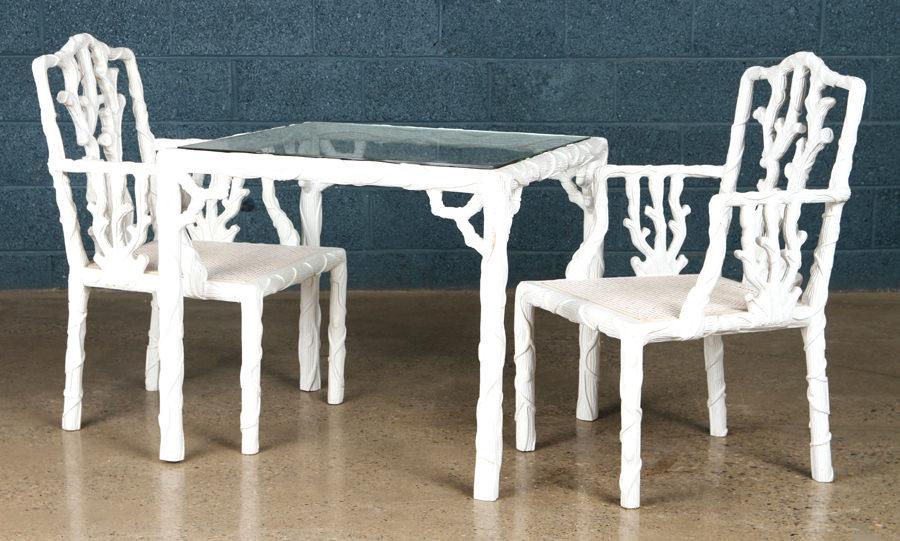 CAST RESIN TABLE AND PAIR MATCHING ARM CHAIRS: A cast resin faux bois glass top table and a pair of matching arm chairs. Table: 28" x 32" x 32" Arm chairs: 38" x 22" x 21" Seat: 16"