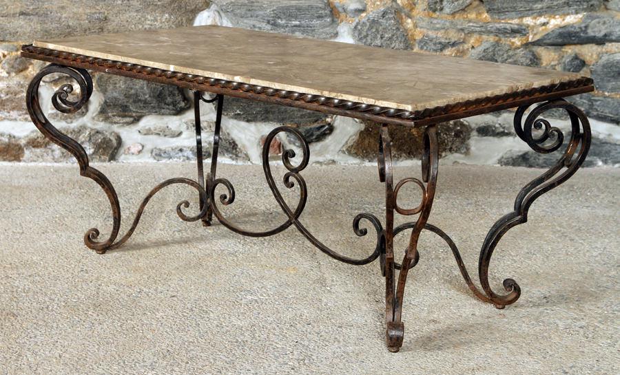 FRENCH WROUGHT IRON MARBLE TOP COFFEE TABLE: A heavy wrought iron French coffee table having a marble top circa 1960. Ht: 18.5" Wd: 41.5" Dpth: 22"