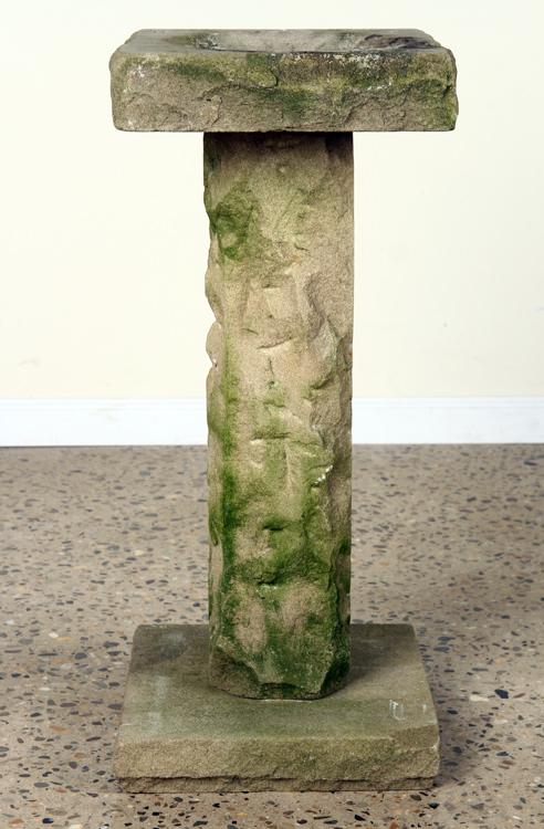 A CARVED STONE BIRD BATH: A carved stone bird bath. Dimensions: Ht: 37.5" Wd: 13.5" Dpth: 13.5"