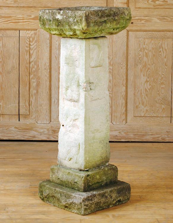 ANTIQUE CUT STONE GARDEN BIRD BATH STEPPED BASE: An antique cut stone garden bird bath having stepped base. Ht: 36.5" Wd: 13" Dpth: 13"