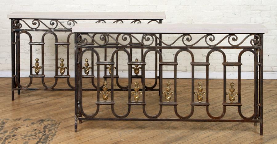 PAIR IRON & BRONZE CONSOLE TABLES TRAVERTINE TOPS: A pair of iron and bronze console tables having travertine tops circa 1900. Ht: 33" Wd: 59" Dpth: 10.5"