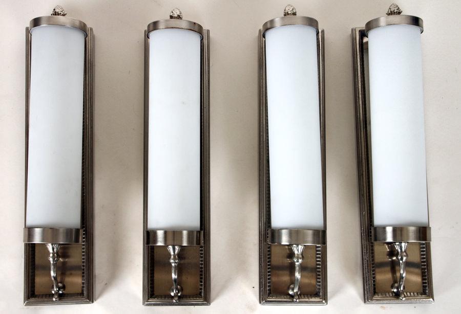 SET OF TEN ART DECO STYLE CHROME GLASS SCONCES: A set of ten Art Deco style chrome and glass sconces having cylindrical glass globes. Recently removed from a Buenos Aires hotel. A larger quantity of these sconces are available. Ht: 4.5" Wd: 20" Dpt