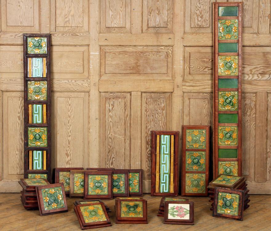 32 WOOD FRAMES W/ ART NOUVEAU TILES C. 1900: A lot of thirty-two wood frames containing ceramic Art Nouveau tiles circa 1900. Lot contains twenty-eight frames each having one 6" x 6" tile and four larger frames.
