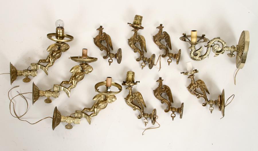 3 BRASS CHERUB SCONCES 6 BRASS EAGLES & 1 SCONCE: A lot of three brass winged cherub wall sconces along with six brass eagles and one brass eagle sconce. Ht: 10" Dpth: 9" (cherubs)