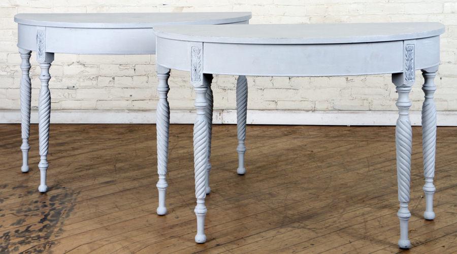 PAIR PAINTED REGENCY STYLE DEMILUNE CONSOLES: A pair of painted Regency style demilune console tables having twist form legs. Ht: 30" Wd: 43.5" Dpth: 22"