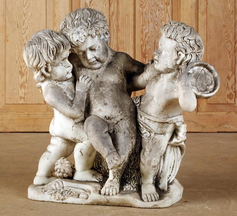 CARVED MARBLE GARDEN STATUE OF THREE PUTTIS: A carved marble garden statue of three puttis. Ht: 29" Wd: 31" Dpth: 15"