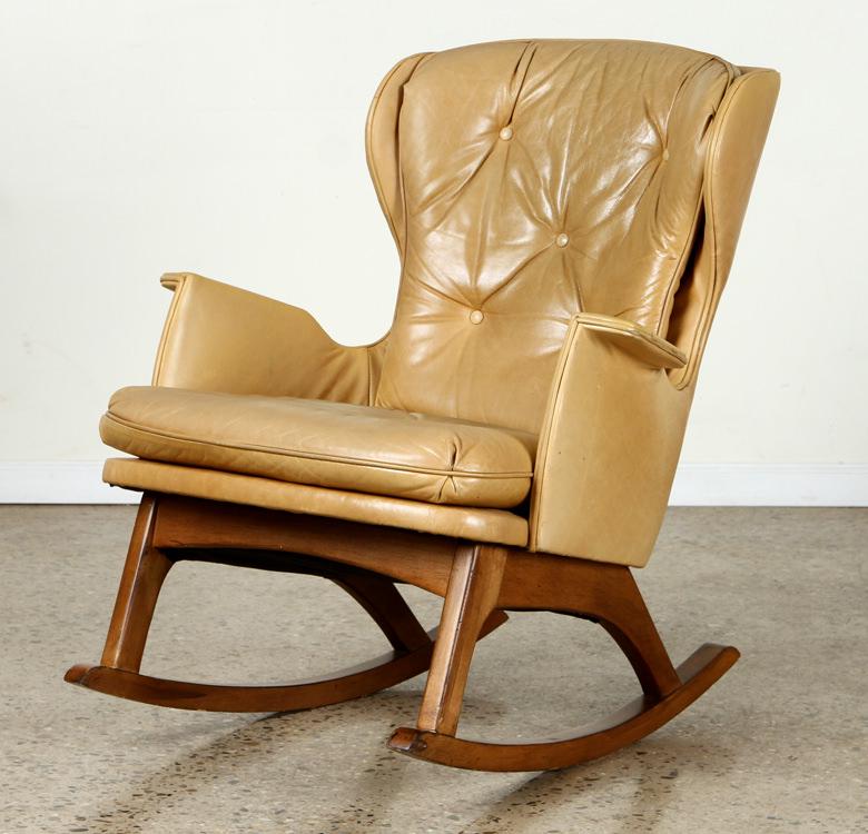 MID CENTURY MODERN LEATHER ROCKING CHAIR: A mid century modern leather rocking chair. Ht: 37" Wd: 32" Dpth: 36" Seat: 16"