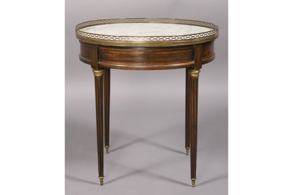 FRENCH LOUIS XVI STYLE GUERIDON MARBLE BRONZE: French Louis XVI style bronze mounted gueridon with marble top framed by open work gallery over bronze trimmed apron on fluted legs circa 1940. Ht: 25 Width: 23.5" ***PLEASE NOTE: All property shall b